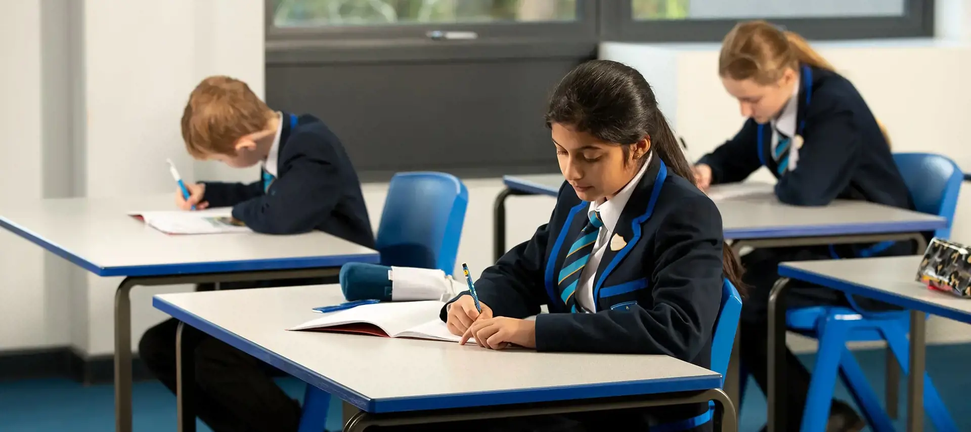 A Senior School student at The Gregg School working in class