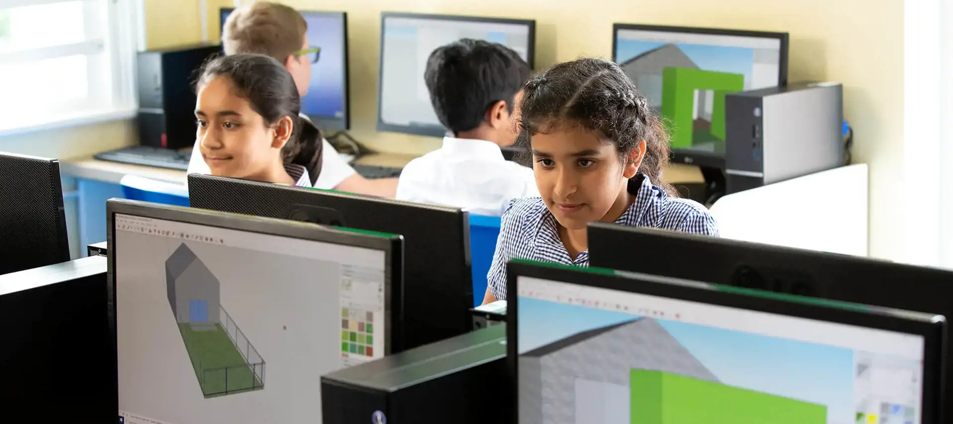 Prep pupils working on computers at The Gregg Prep School